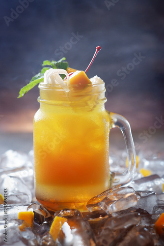 A glass of orange juice with a cherry on top 01