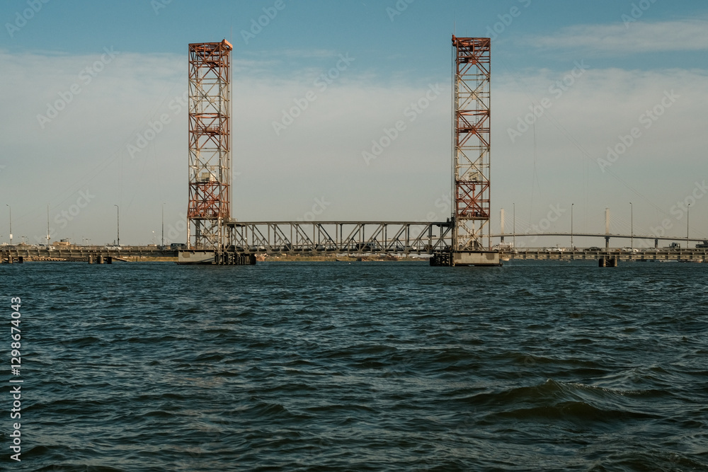 Obraz premium Rusty Drawbridge Over Calm Water