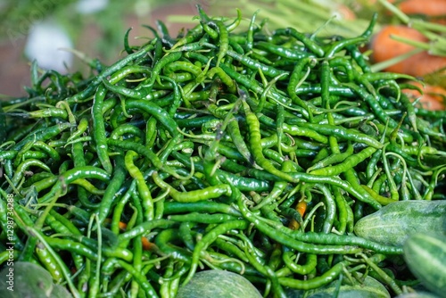 Fototapeta pile of green Chili or cayenne peppers