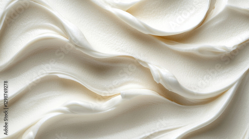 Smooth, creamy texture of white whipped cream or frosting, creating elegant waves
