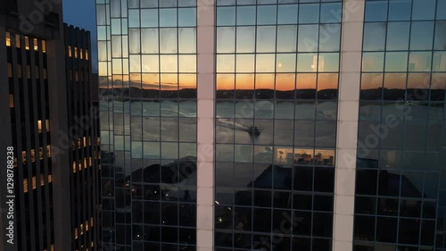 A Beautiful Aerial View Of Corporate Office Windows In Halifax At Night. The Glowing Lights And Active Workers Inside Showcase The Energetic City Life And Corporate Environment After Hours.