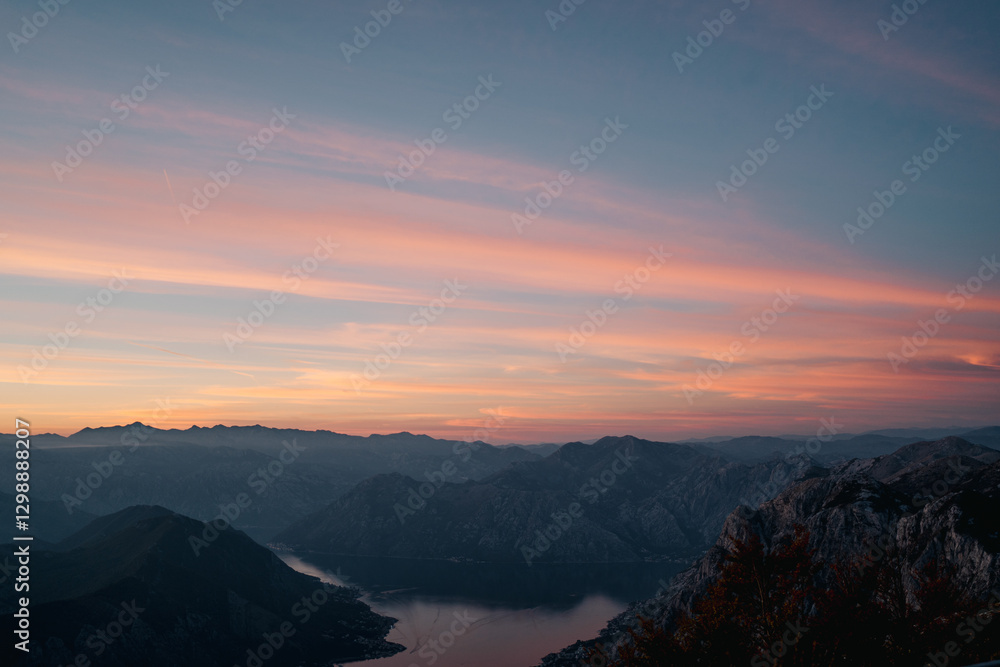 Sunset sky over a mountain range by the bay Sunset sky over a mountain range by the bay