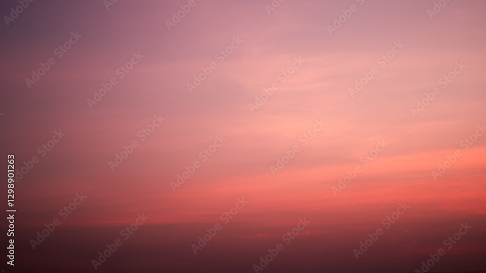 Obraz premium Calm sky in winter evening, Background image of sky gradient with beautiful pastel pink and orange and purple in the evening as the sun sets, Atmosphere of the twilight sky was calmin in evening.