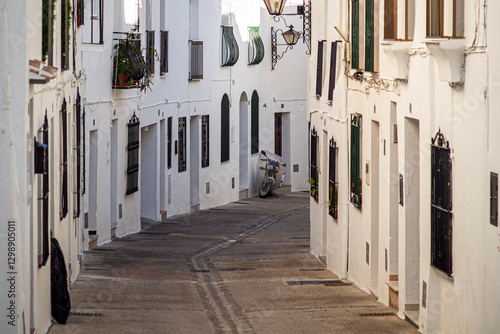 Narrow street and small white houses in Mijas, Spain