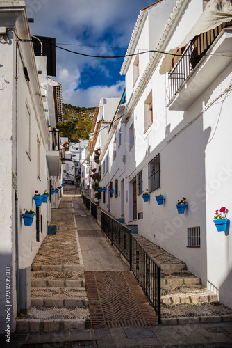 Narrow pedestrian street in Mijas white village, Spain