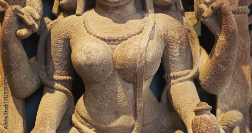 Obraz na płótnie Close-up view on Ancient Stone Bas-relief Of Brahmani Or Brahmi, One Of Seven Hindu Mother Goddesses Known As Sapta Matrikas. She Is Aspect Of Adi Shakti, Possessing rajas Guna And Is Therefore Source w salonie