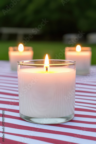serene moment with glowing candles on striped tablecloth, perfect for reflection