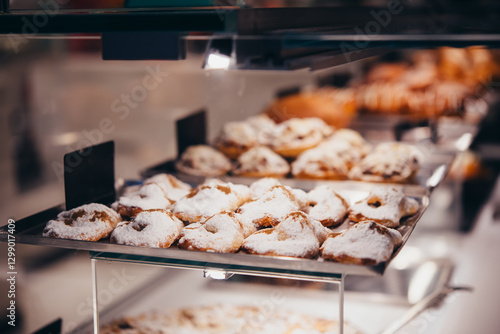 Obraz na płótnie Different kinds of fresh pastry, and buns on sale at a bakery or a cafe. w salonie