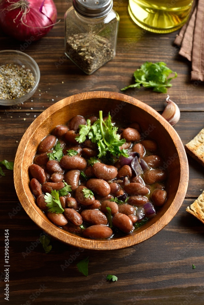 Fototapeta premium Baked red beans in bowl on wooden table