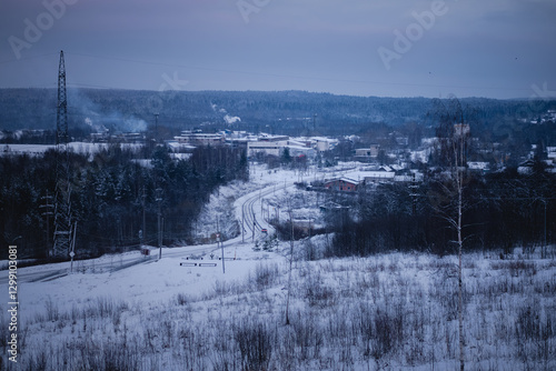 A winter view of an industrial settlement in northern Russia, surrounded by snow and frost.