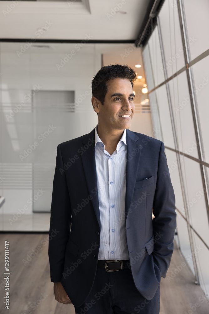 Satisfied with career. Successful smiling middle aged businessman startup enterprise owner corporate leader stand by window in his company office enjoy leadership feel motivated to overcome challenge Satisfied with career. Successful smiling middle aged businessman startup enterprise owner corporate leader stand by window in his company office enjoy leadership feel motivated to overcome challenge