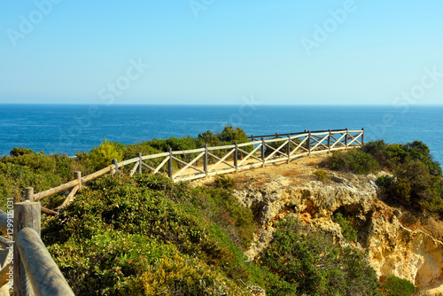 walking path with breathtaking views through the coast from porches to benagil caves lagoa algarve portugal