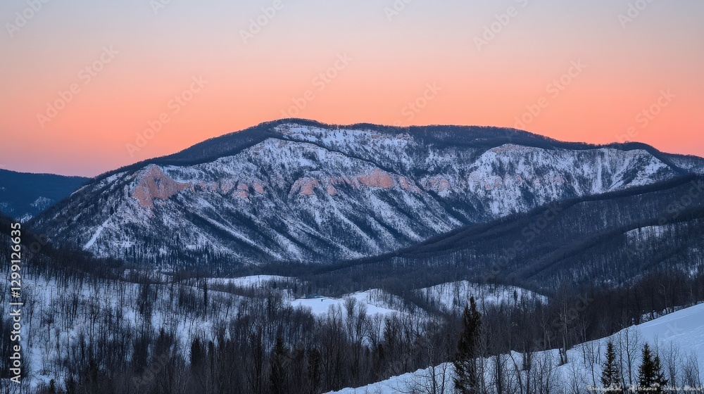 Obraz premium Serene Sunrise Over Icy Mountain Peaks with Pink and Orange Hues