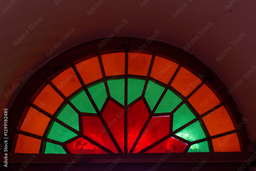 Fototapeta premium A window into the past, glowing with heritage. Wooden stained glass windows.