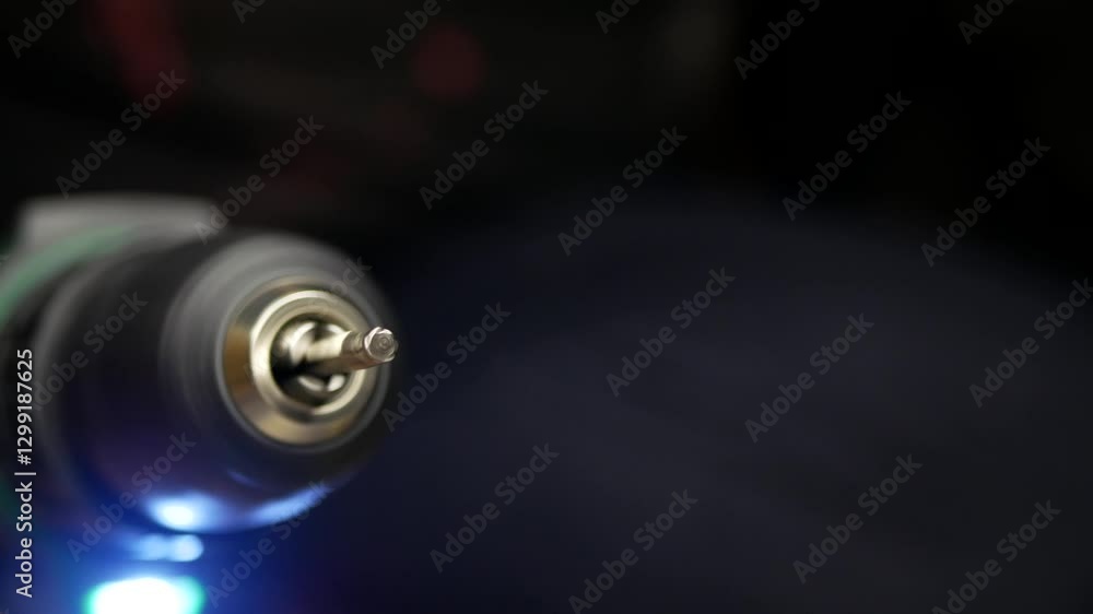 Close-up of cordless drill. Torx screwdriver bit is rotating at speed. Repair and construction theme Close-up of cordless drill. Torx screwdriver bit is rotating at speed. Repair and construction theme