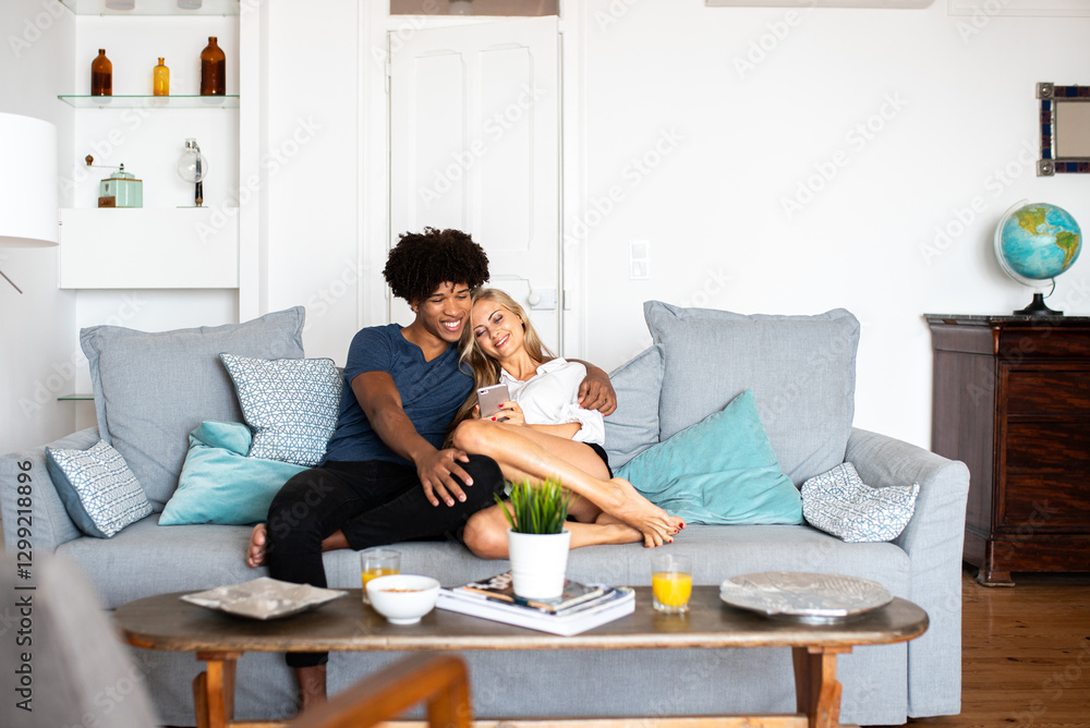 Couple Enjoying Relaxed Time on a Comfortable Couch Couple Enjoying Relaxed Time on a Comfortable Couch