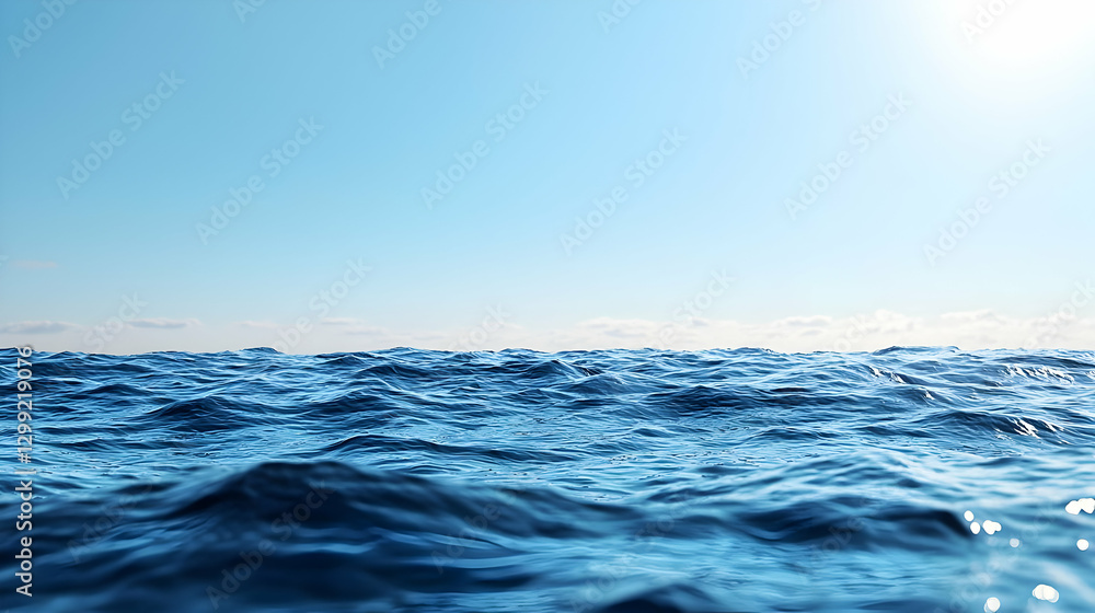 Obraz premium Blue Ocean Surface Under Clear Sky with Sunlight and Calm Water During Daytime