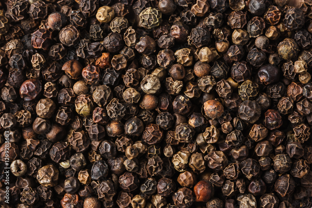Whole black peppercorns close-up. Whole black peppercorns close-up.