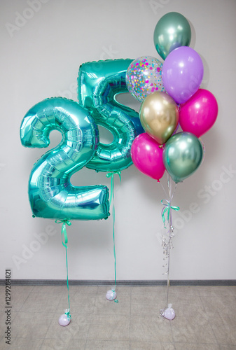25 mint colored balloons and a bouquet of helium balloons
