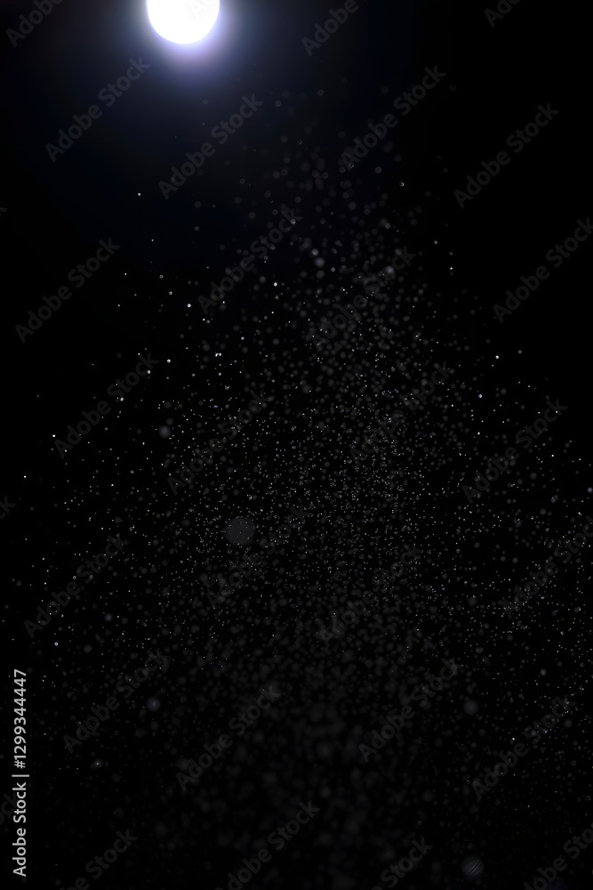 Obraz premium gotitas iluminadas en fondo negro 