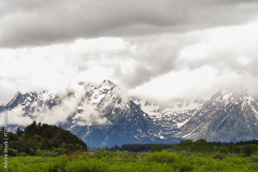 Grand Tetons mountain landscape with heavenly clouds Grand Tetons mountain landscape with heavenly clouds