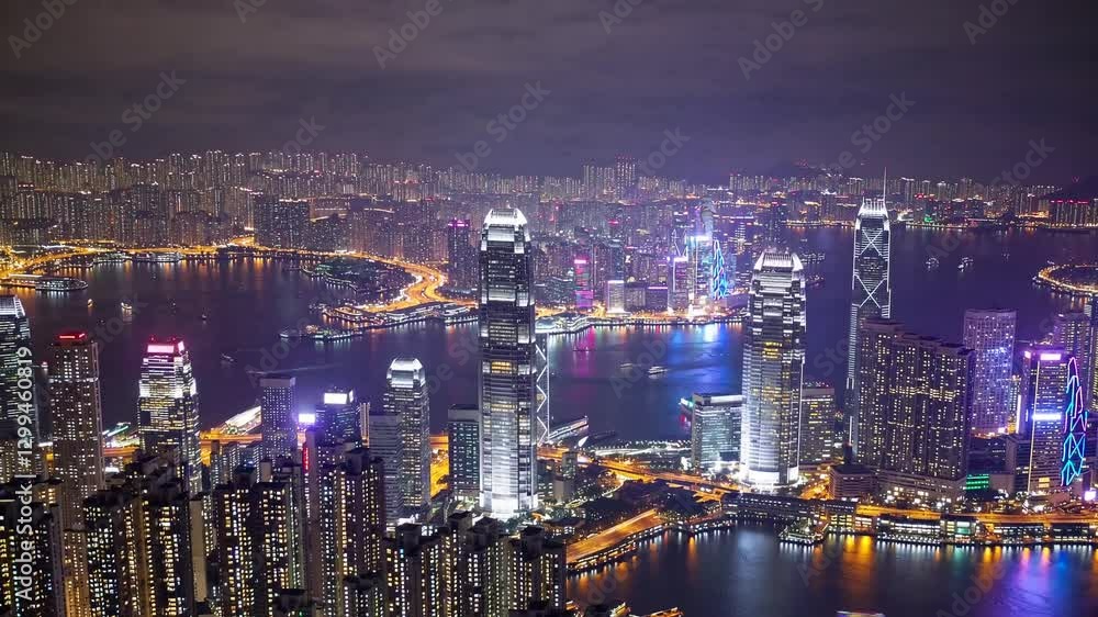 Slow Motion Aerial View of Stunning Hong Kong City Nightscape, Illuminated Skyscrapers and City Lights Reflecting on Victoria Harbour, Dynamic Urban Scene, Vibrant Metropolitan Skyline, City Atmospher Slow Motion Aerial View of Stunning Hong Kong City Nightscape, Illuminated Skyscrapers and City Lights Reflecting on Victoria Harbour, Dynamic Urban Scene, Vibrant Metropolitan Skyline, City Atmospher