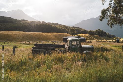 Old and rusty abandoned car on a field