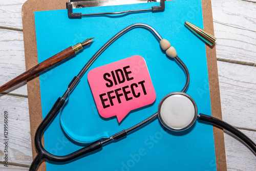 On the tablet for writing the text Side Effects, next to the stethoscope. photo