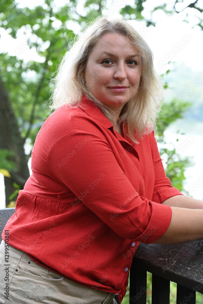 Obraz premium middle-aged blonde woman on nature background