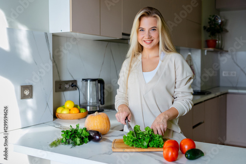 Woman Preparing Fresh Vegetables in a Modern Kitchen Setting photo