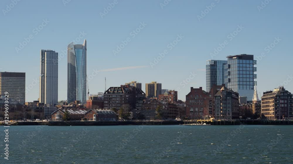 View of beautiful Boston cityscape skyline seen from Piers Park on a cold clear winter afternoon View of beautiful Boston cityscape skyline seen from Piers Park on a cold clear winter afternoon