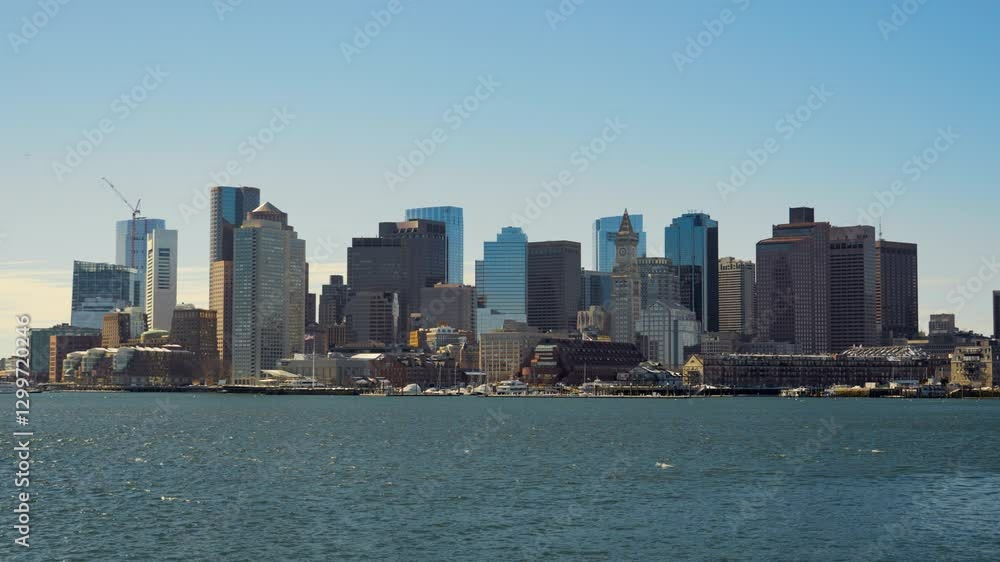 View of beautiful Boston cityscape skyline seen from Piers Park on a cold clear winter afternoon View of beautiful Boston cityscape skyline seen from Piers Park on a cold clear winter afternoon