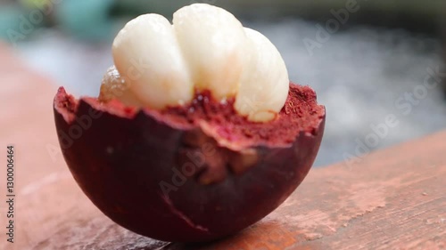 Fresh mangosteen fruit with white juicy flesh