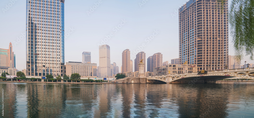 Fototapeta premium The urban architectural skyline, modern bridges, and Haihe River scenery of Tianjin, China on August 11, 2024 