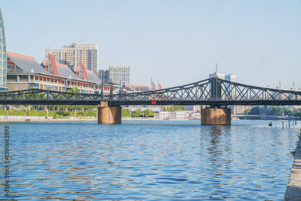 Naklejka premium The urban architectural skyline, modern bridges, and Haihe River scenery of Tianjin, China on August 11, 2024