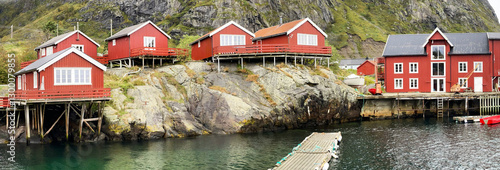wooden house on red stilts typical of the villages in the archipelago of Lofo...