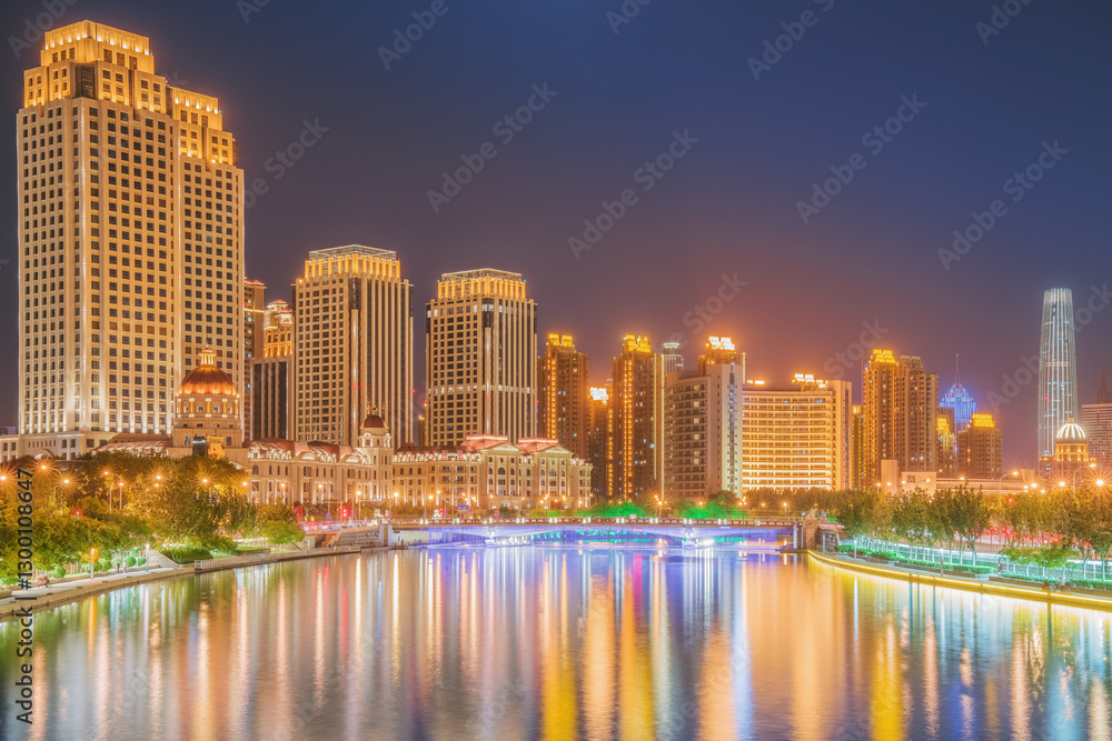 Naklejka premium The urban architectural skyline, modern bridges, and Haihe River night scenery of Tianjin, China on August 11, 2024