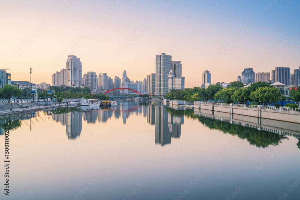 Obraz premium The urban architectural skyline, modern bridges, and Haihe River scenery of Tianjin, China on August 11, 2024
