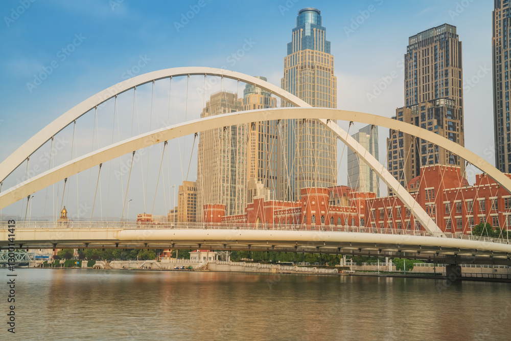 Naklejka premium The urban architectural skyline, modern bridges, and Haihe River scenery of Tianjin, China on August 11, 2024
