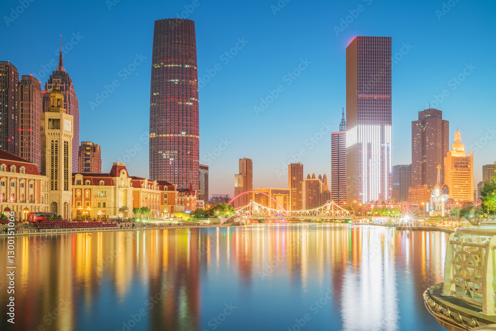 Naklejka premium The urban architectural skyline, modern bridges, and Haihe River night scenery of Tianjin, China on August 11, 2024 