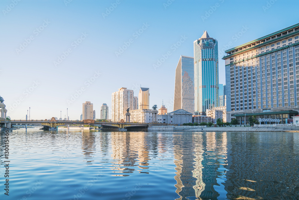 Naklejka premium The urban architectural skyline, modern bridges, and Haihe River scenery of Tianjin, China on August 11, 2024