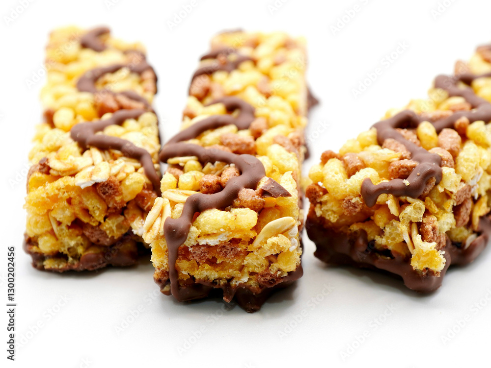 Delicious cereal bars with chocolate against the white background Delicious cereal bars with chocolate against the white background