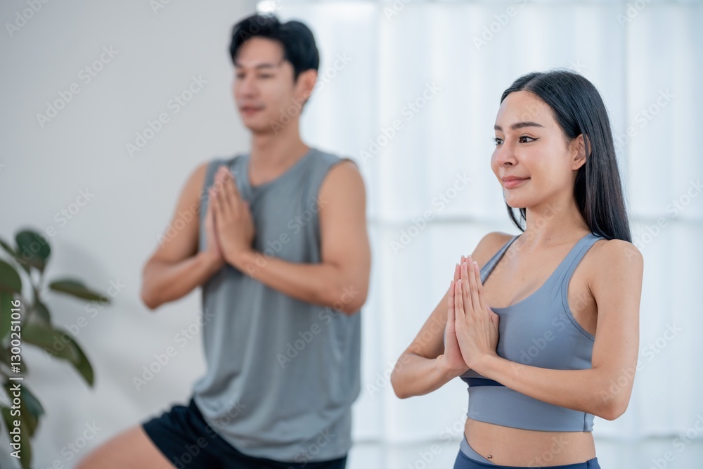 Practicing yoga in a bright and serene indoor space for relaxation and mindfulness Practicing yoga in a bright and serene indoor space for relaxation and mindfulness