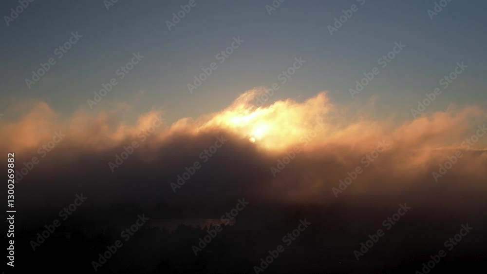 Aerial: foggy sunrise with clouds and skyscape during the day, pan drone shot Aerial: foggy sunrise with clouds and skyscape during the day, pan drone shot