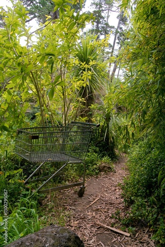 Принти на полотні Abandoned Shopping Cart in the Wild Bush – Urban Relic Overtaken by Nature