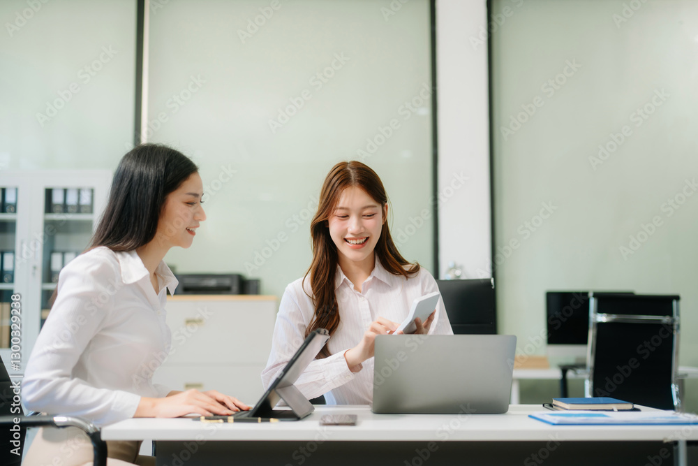 Businesswoman leading team meeting and using tablet and laptop computer with financial Businesswoman leading team meeting and using tablet and laptop computer with financial