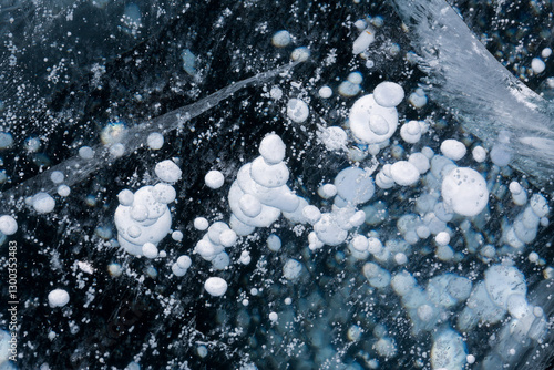 Obraz na płótnie Gas methane bubbles frozen in blue ice of lake Baikal