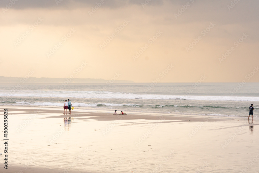 Beautiful beach scene with cloudy at sunset with people during vacation Beautiful beach scene with cloudy at sunset with people during vacation