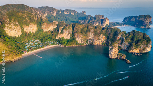 Drone footage of Krabi coastline with limestone cliffs and calm turquoise waters, capturing the beauty of Thailand’s southern tropical seascape and rugged nature