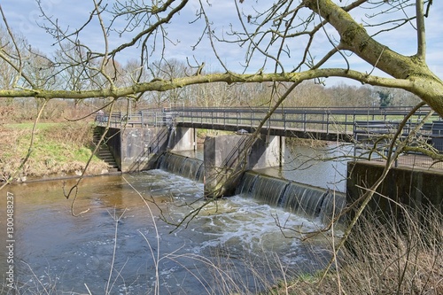 Weir annex bicycle bridge in river Bocholter Aa photo